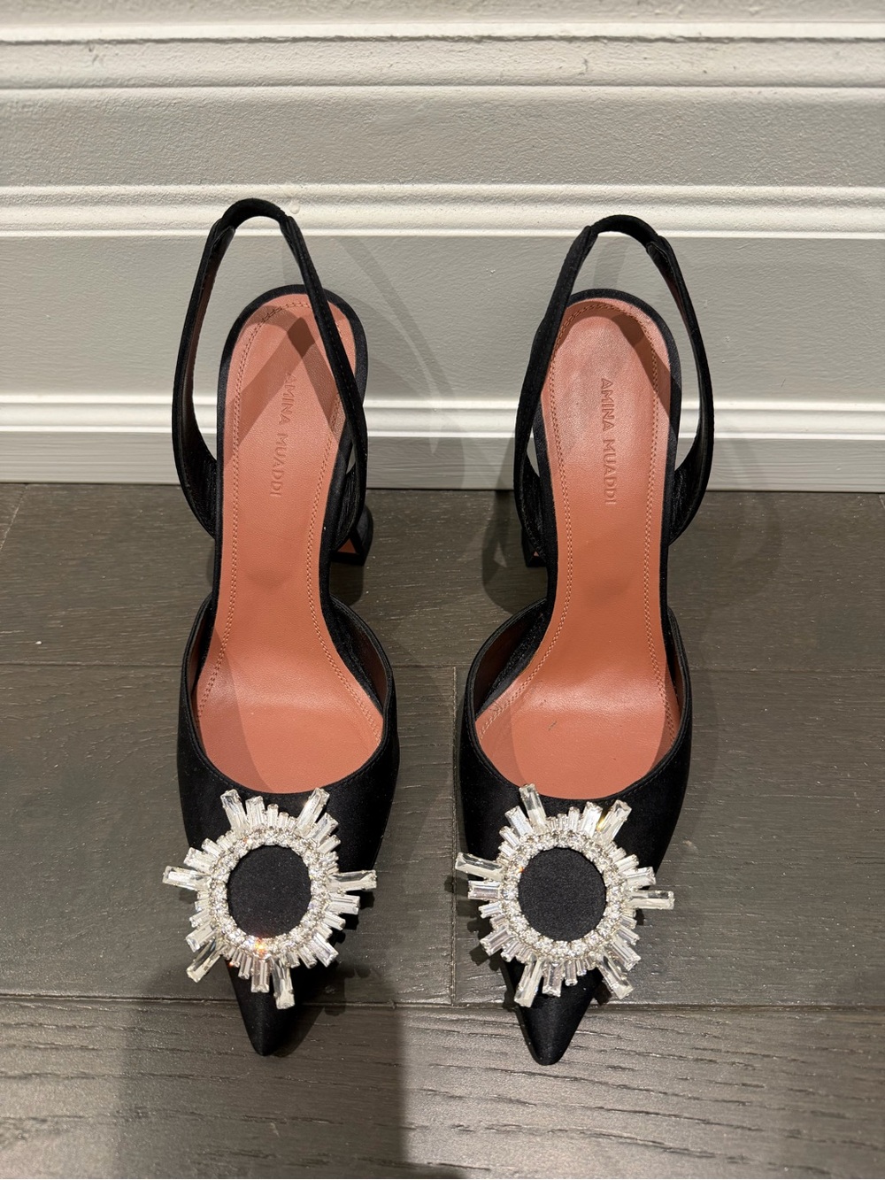 Amina Muaddi Black Pointed Slingback Pumps with Crystal Sunburst Accents